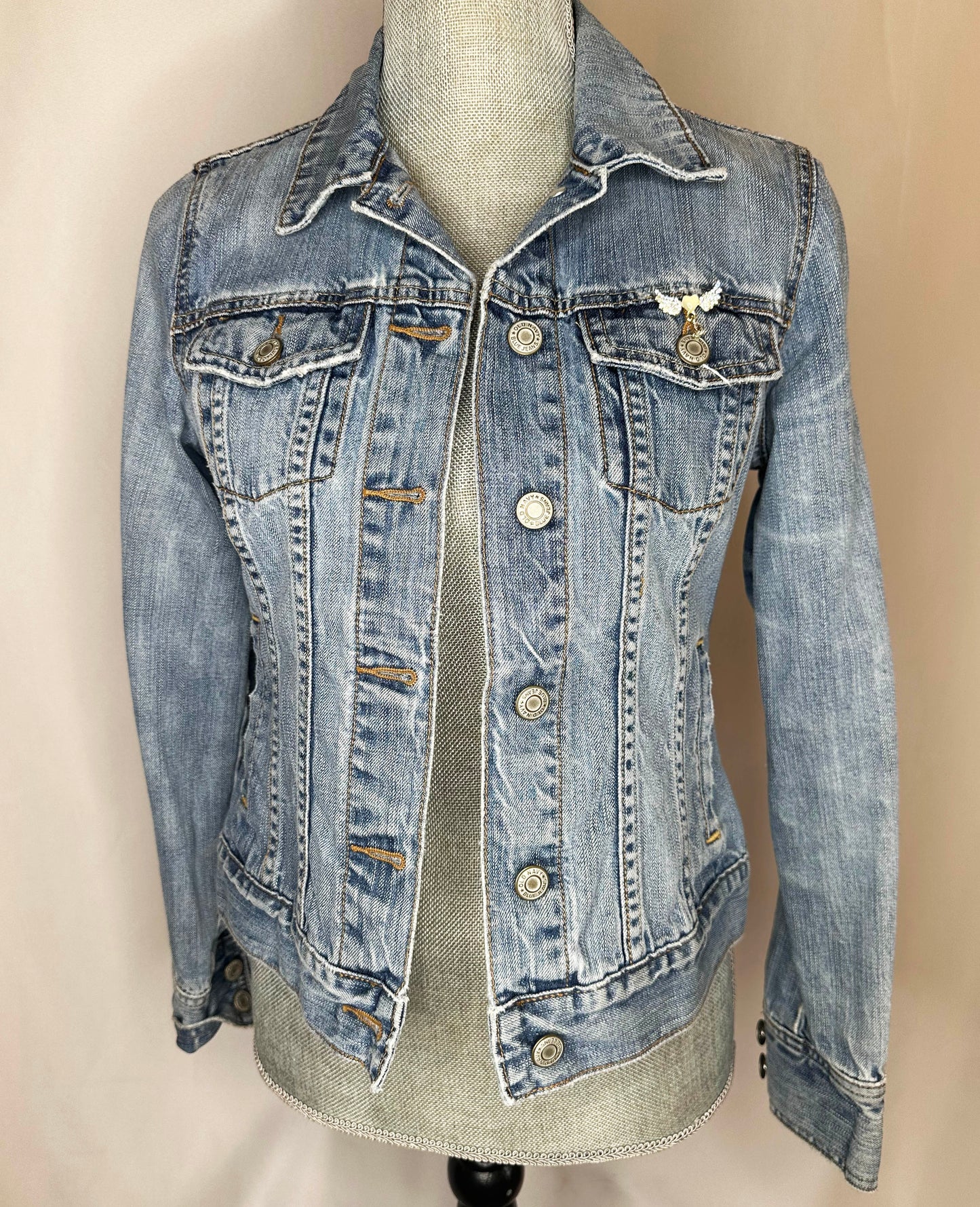"Cowgirl Club" Fringed Womens Denim Jacket Front Side featuring double button pockets and detailing on left pocket.
