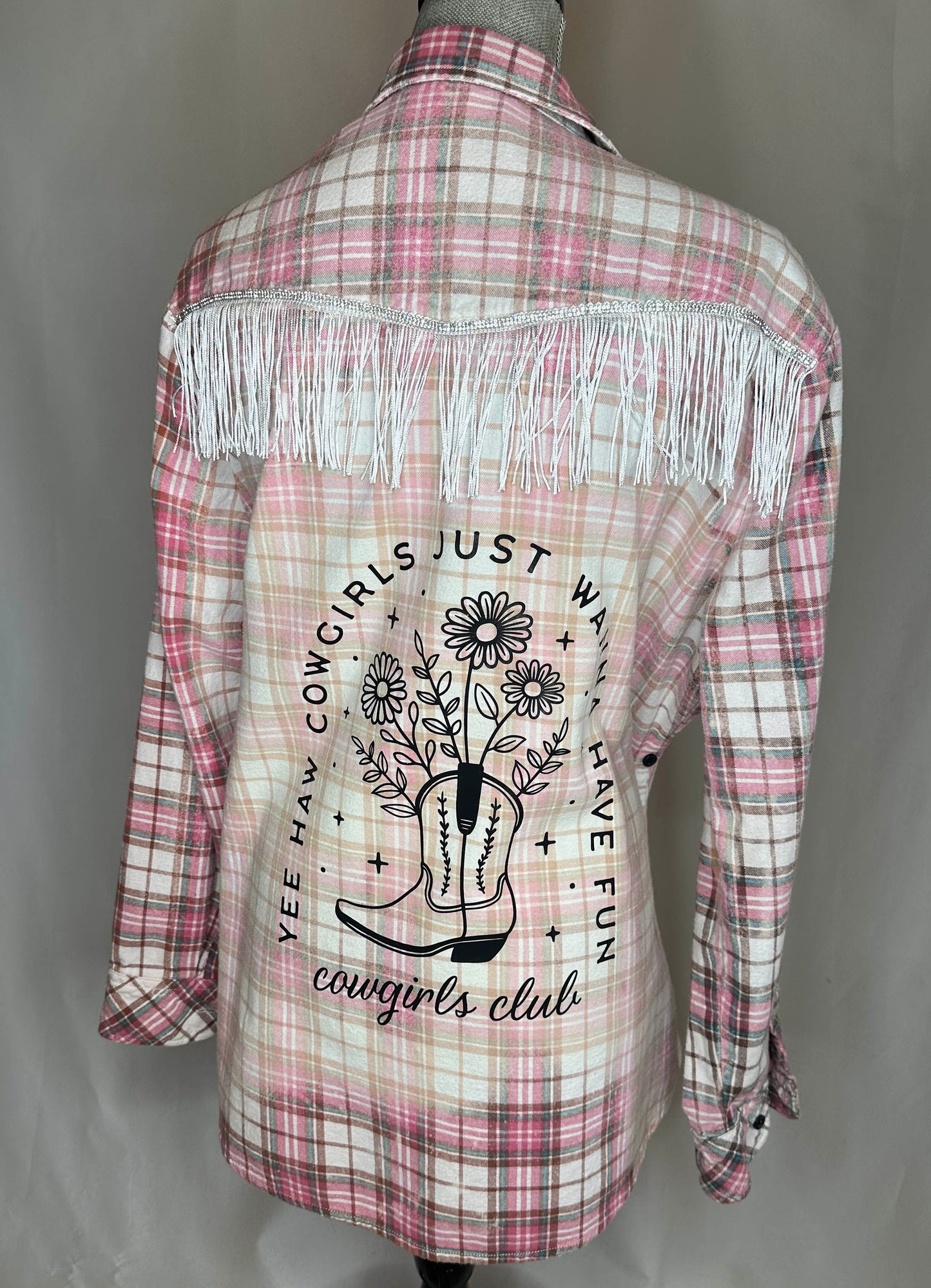 Womens cowgirls club "girls just want to have fun" flannel with silver and white fringe back side