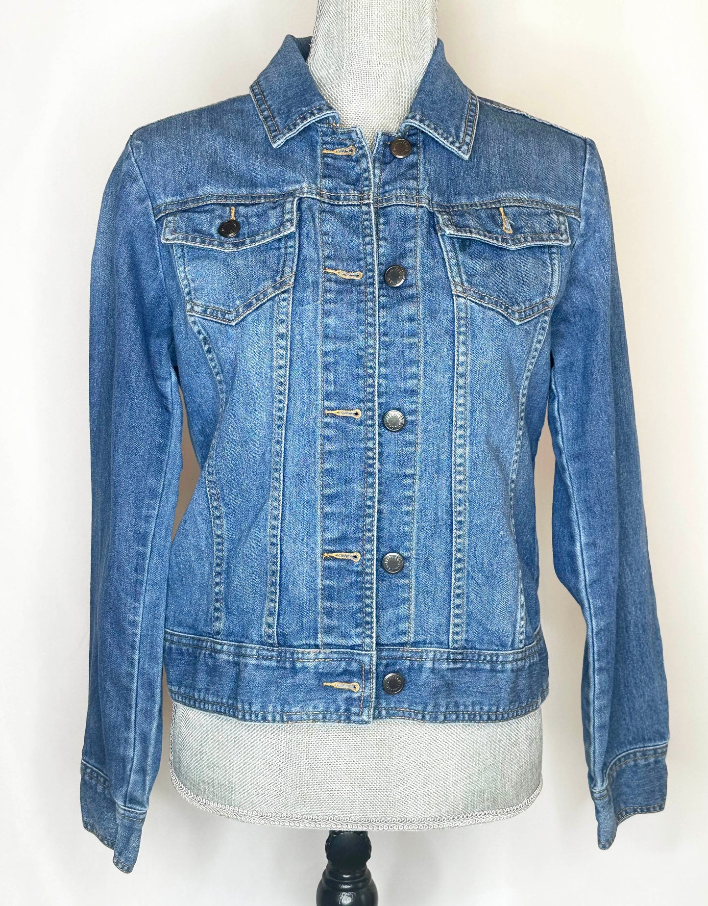 "From her cowboy roots" Womens Denim Jacket Front Side featuring button up, double pockets, collar and seamless stitching.