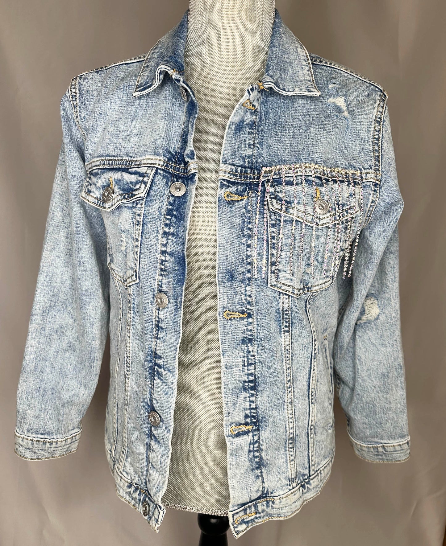 "Lucky" Women's Fringed Denim Jacket Front Side with rhinestone fringe detailing on left side front pocket.