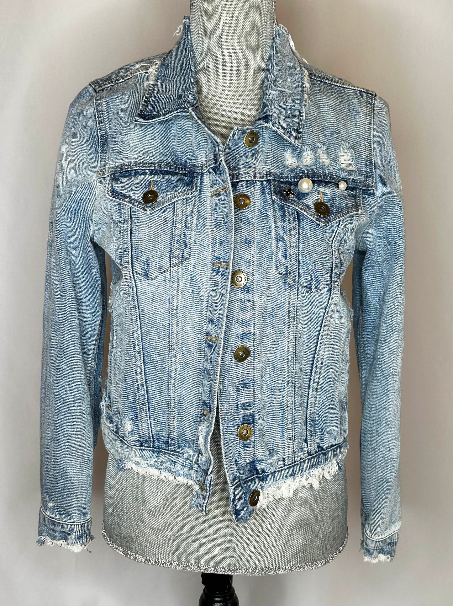 "Retro Cowgirl" Women's Denim jacket Front Side featuring distressed design, double button pockets with pear detailing on left front pocket.