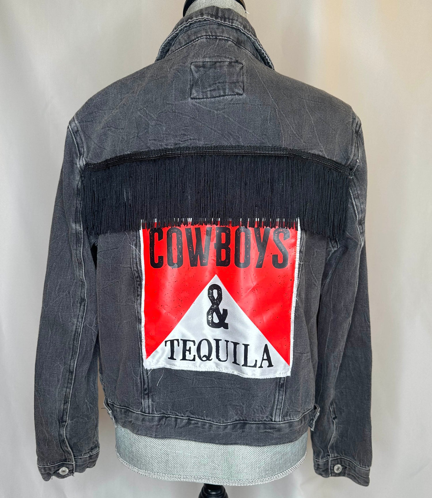 Black fringe "Cowboys & Tequila" Womens Denim Jacket Back Side with navy blue fringe detailing and satin patch