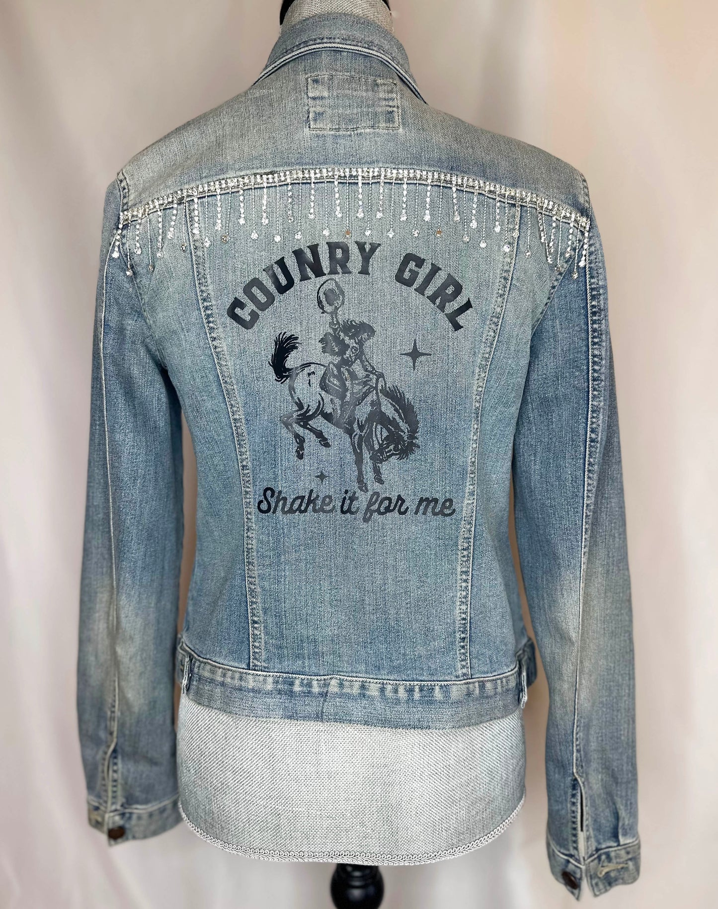 Full crystal fringe "Country girl shake it for me"  Womens Denim Jacket back side with rhinestone waterfall detailing and shake it for me print 