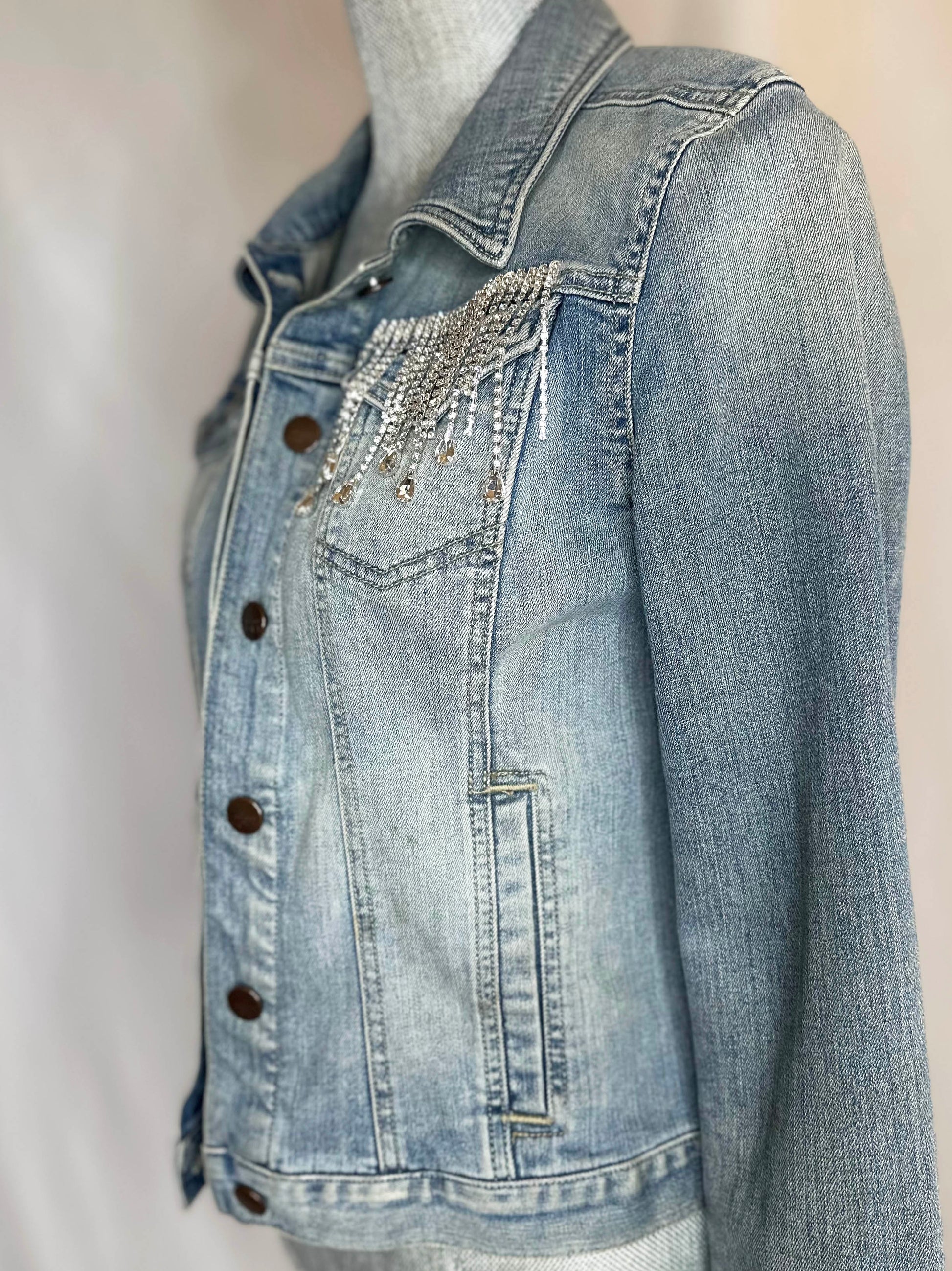 Full crystal fringe "Country girl shake it for me"  Womens Denim Jacket left side view with rhinestone waterfall detailing on left pocket