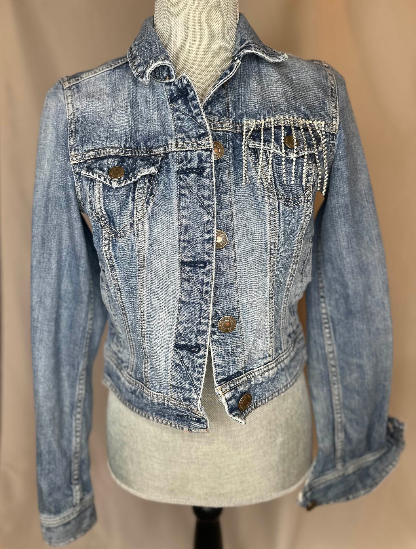 White Fringe "Country girl shake it for me"  Womens Denim Jacket Front Side with rhinestone waterfall detailing on front left pocket