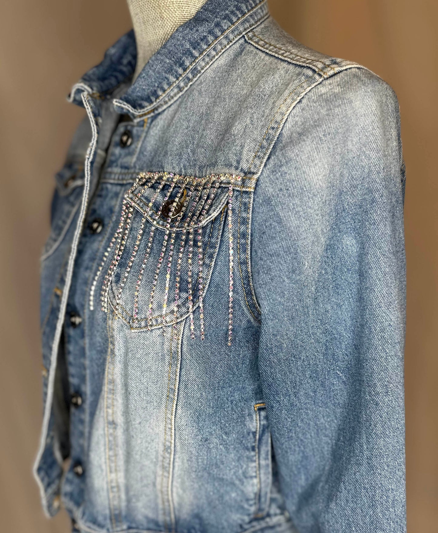 White Fringe "Country girl shake it for me"  Womens Denim Jacket Front Side Angle with rhinestone waterfall detailing on front left pocket